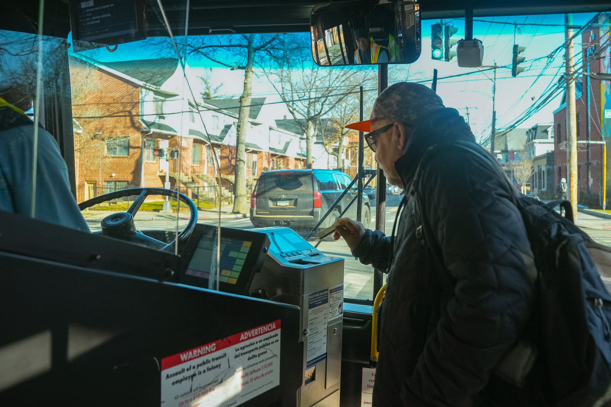 A customer paying their fare onboard